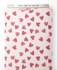 Tissu - Cœurs rouges sur rose pâle