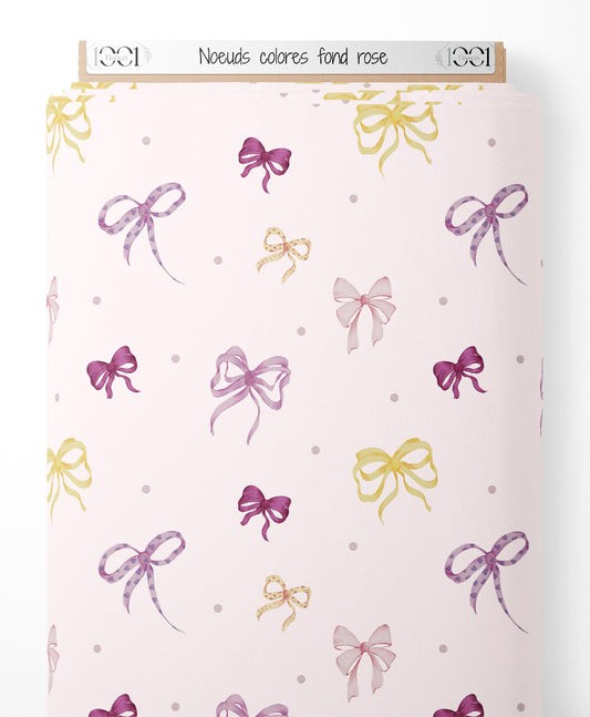 Tissu - Nœuds colorés sur fond rose