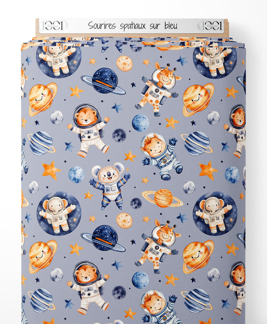 Tissu - Sourires spatiaux sur bleu