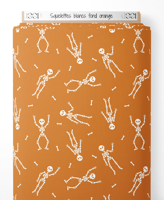 Tissu - Squelettes blancs sur fond orange