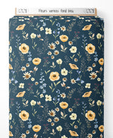 Tissu - Fleurs variées sur fond bleu
