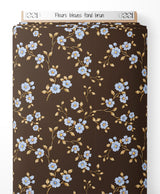Tissu - Fleurs bleues sur fond brun