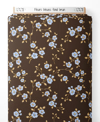Tissu - Fleurs bleues sur fond brun