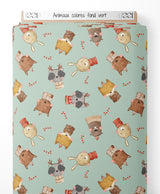 Tissu - Animaux colorés sur fond vert