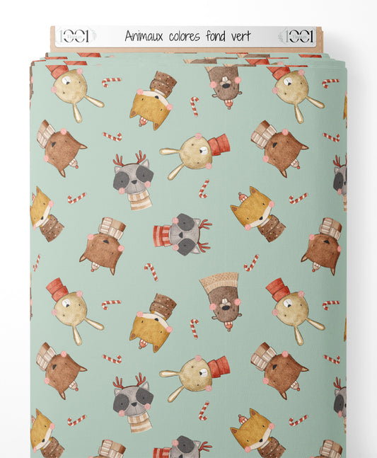 Tissu - Animaux colorés sur fond vert