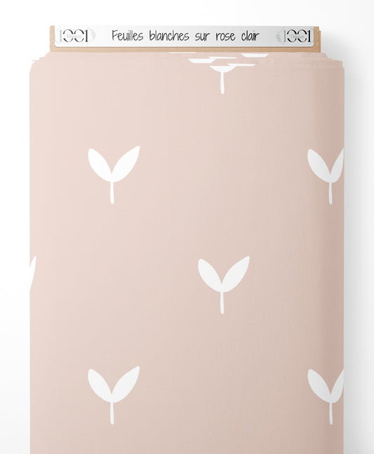 Tissu - Feuilles blanches sur rose clair