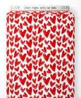 Tissu - Cœurs rouges variés sur blanc