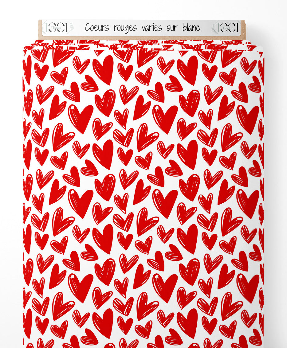 Tissu - Cœurs rouges variés sur blanc