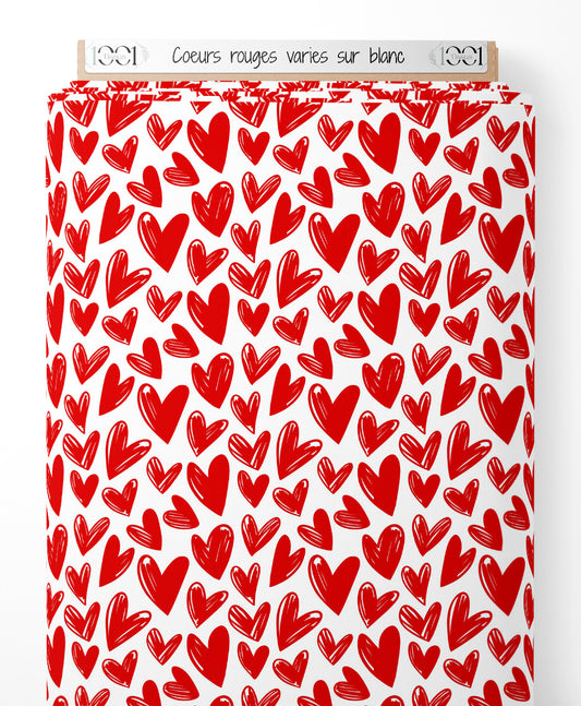Tissu - Cœurs rouges variés sur blanc