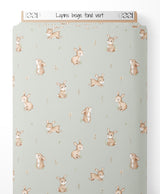Tissu - Lapins beige sur fond vert