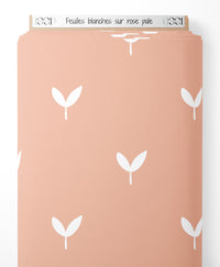Tissu - Feuilles blanches sur rose pâle