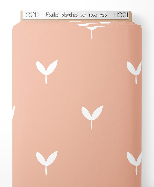 Tissu - Feuilles blanches sur rose pâle