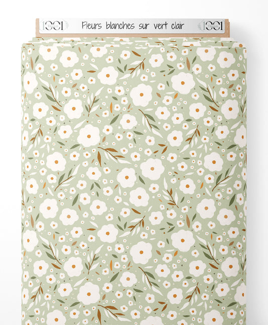 Tissu - Fleurs blanches sur vert clair